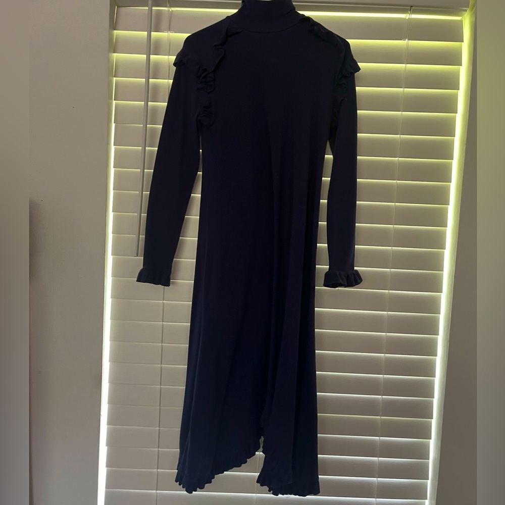 Navy blue dress, almost sweater material.
